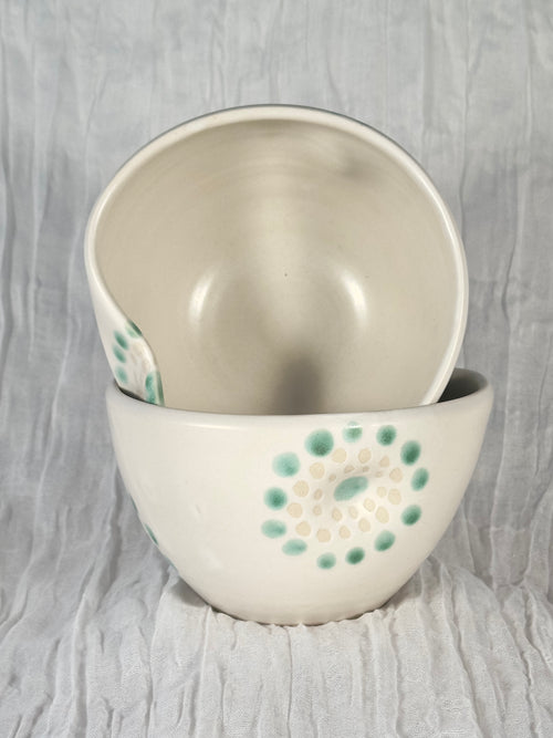 Ceramic bowl with radial dot patterns 