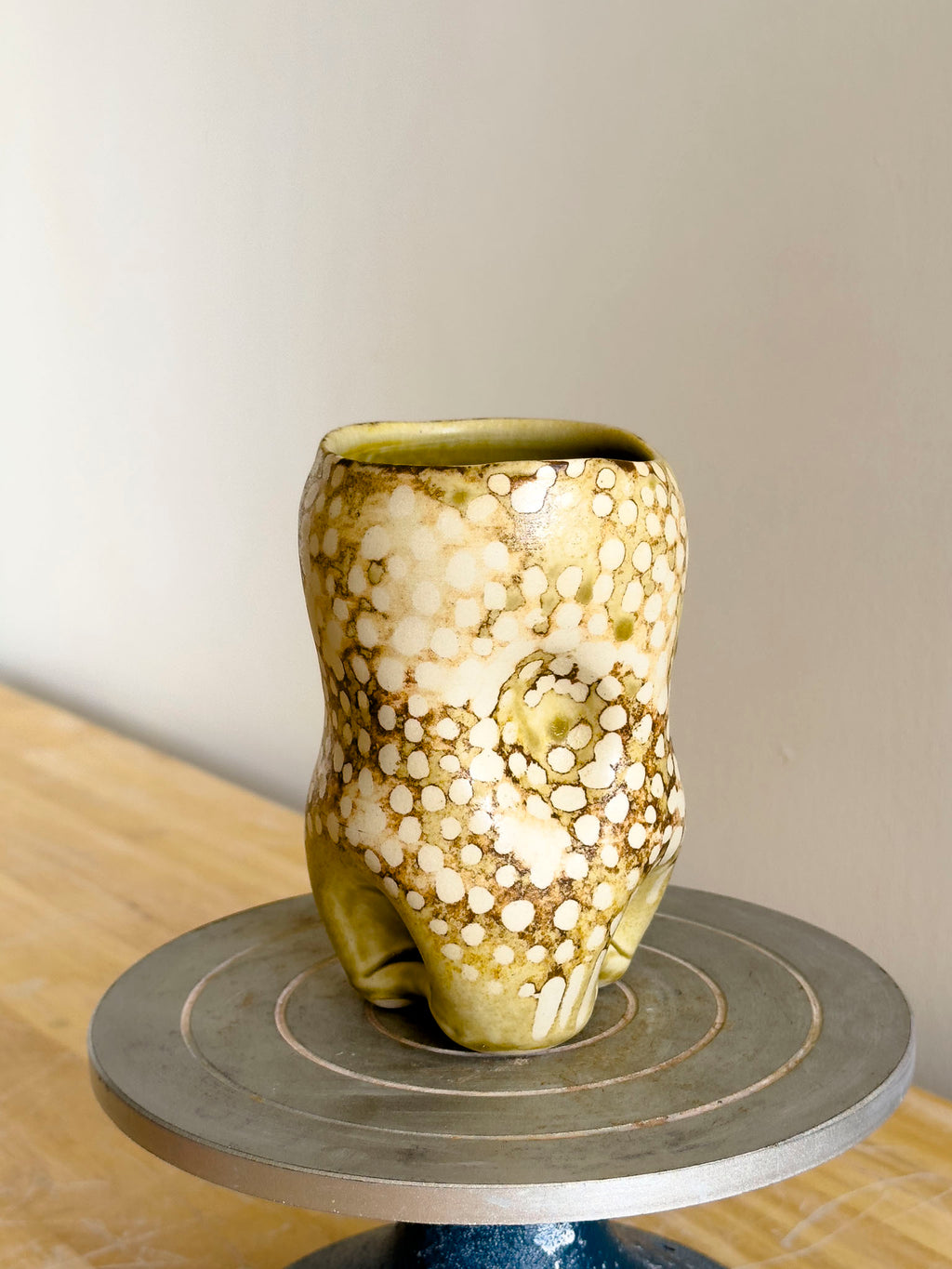 Organic cup with voluptuous form and tactile surface details