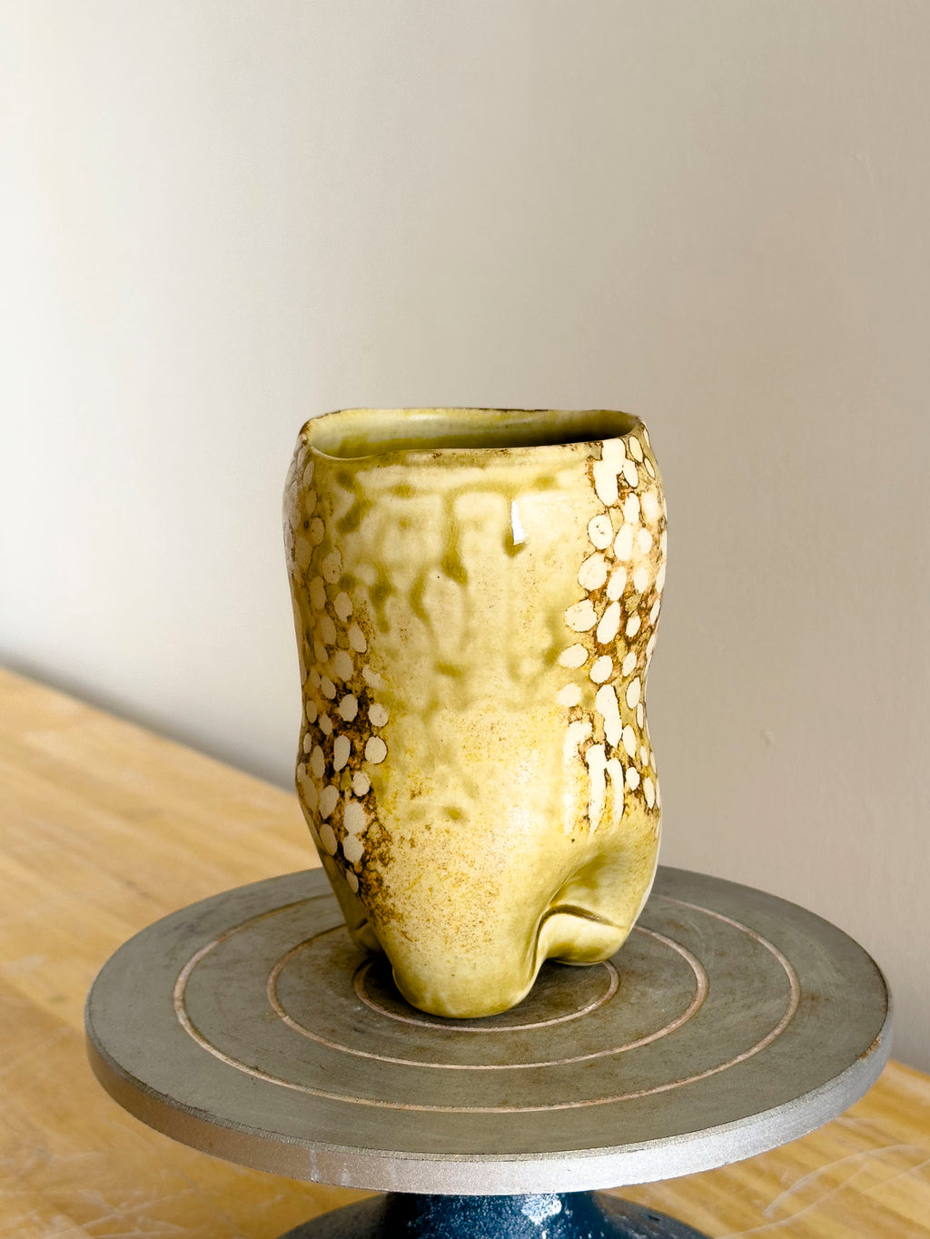 Organic cup with voluptuous form and tactile surface details