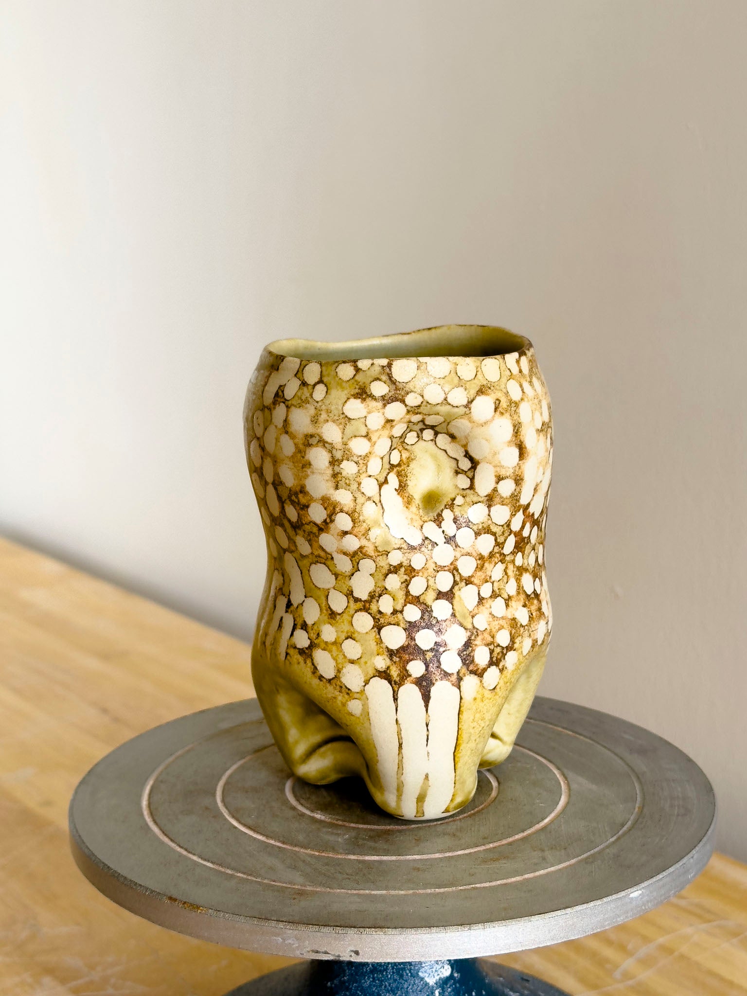 Organic cup with voluptuous form and tactile surface details